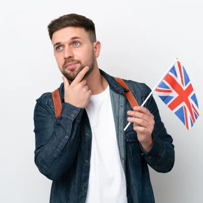 young-caucasian-man-holding-united-kingdom-flag-isolated-white-background-having-doubts_1368-349895